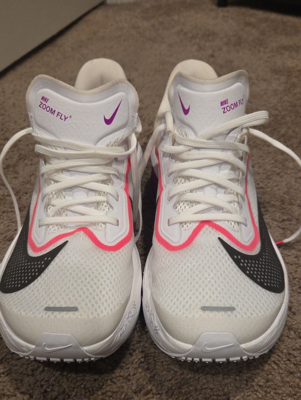Nike Women's White Running Shoes with Pink and Black Accents